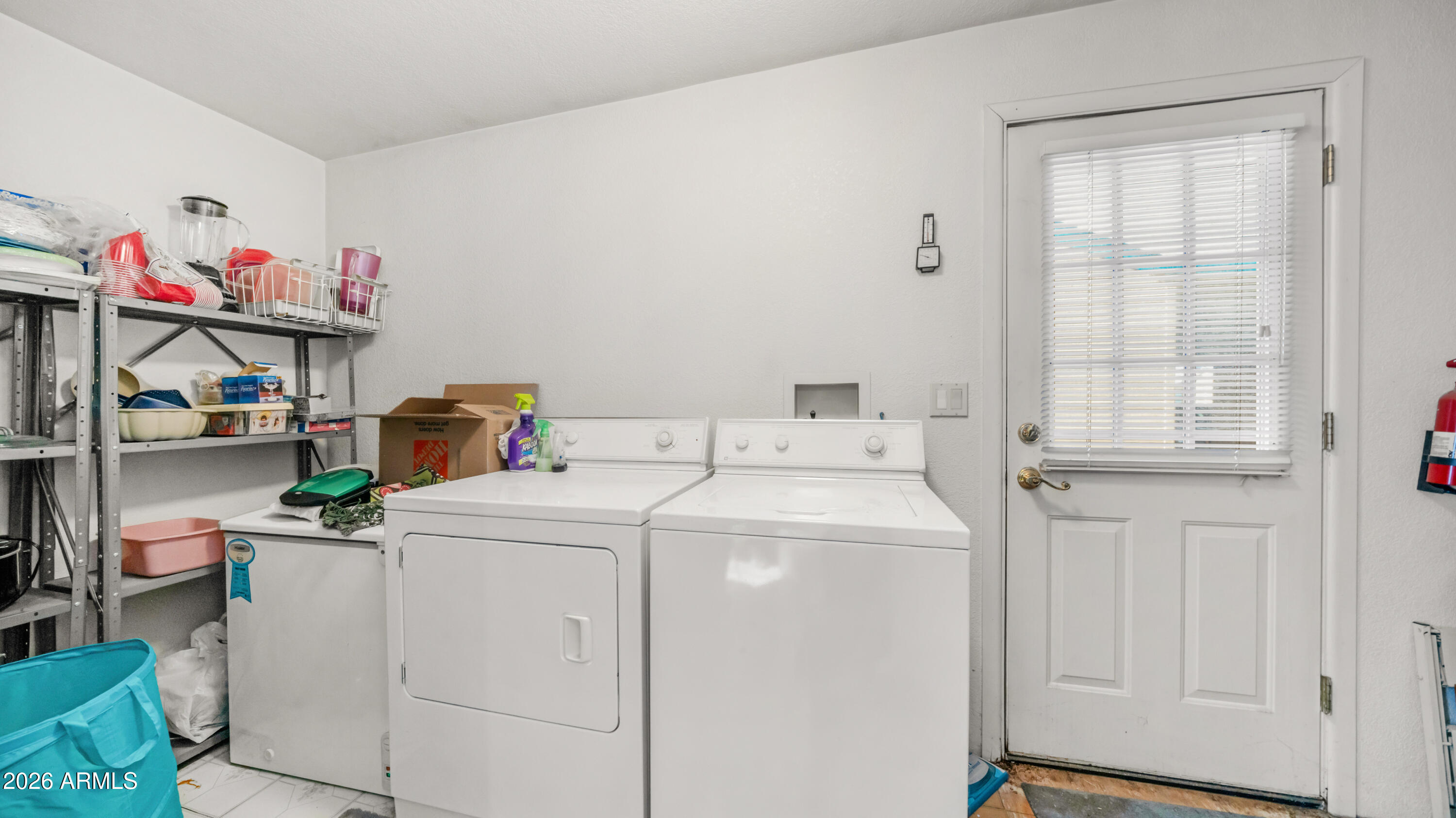 3710 South Goldfield Road, Unit 972 Apache Junction, AZ 85119 - Photo 27 of 60 a utility room with dryer and washer
