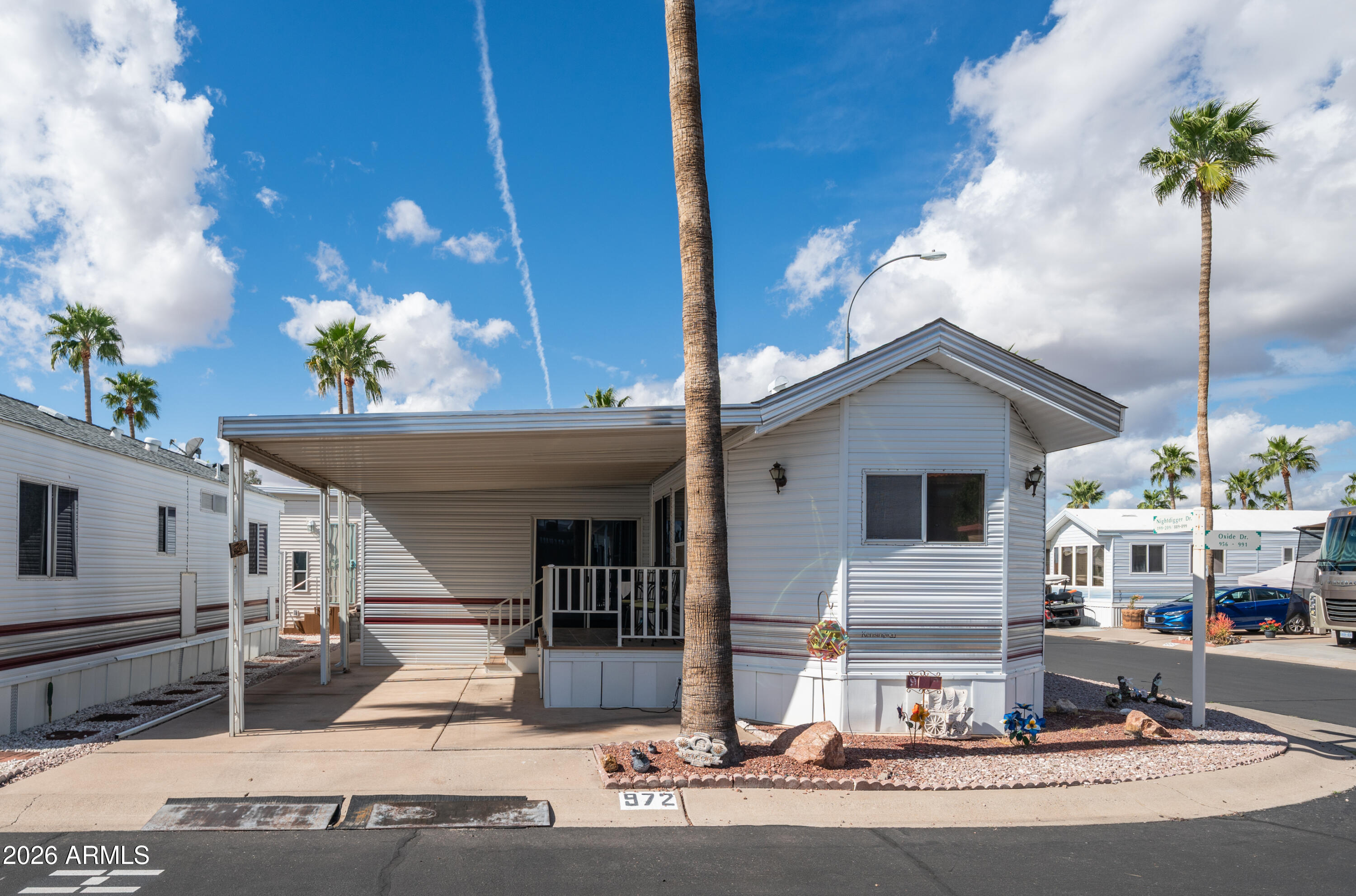 3710 South Goldfield Road, Unit 972 Apache Junction, AZ 85119 - Photo 3 of 60 a view of a house with a outdoor space