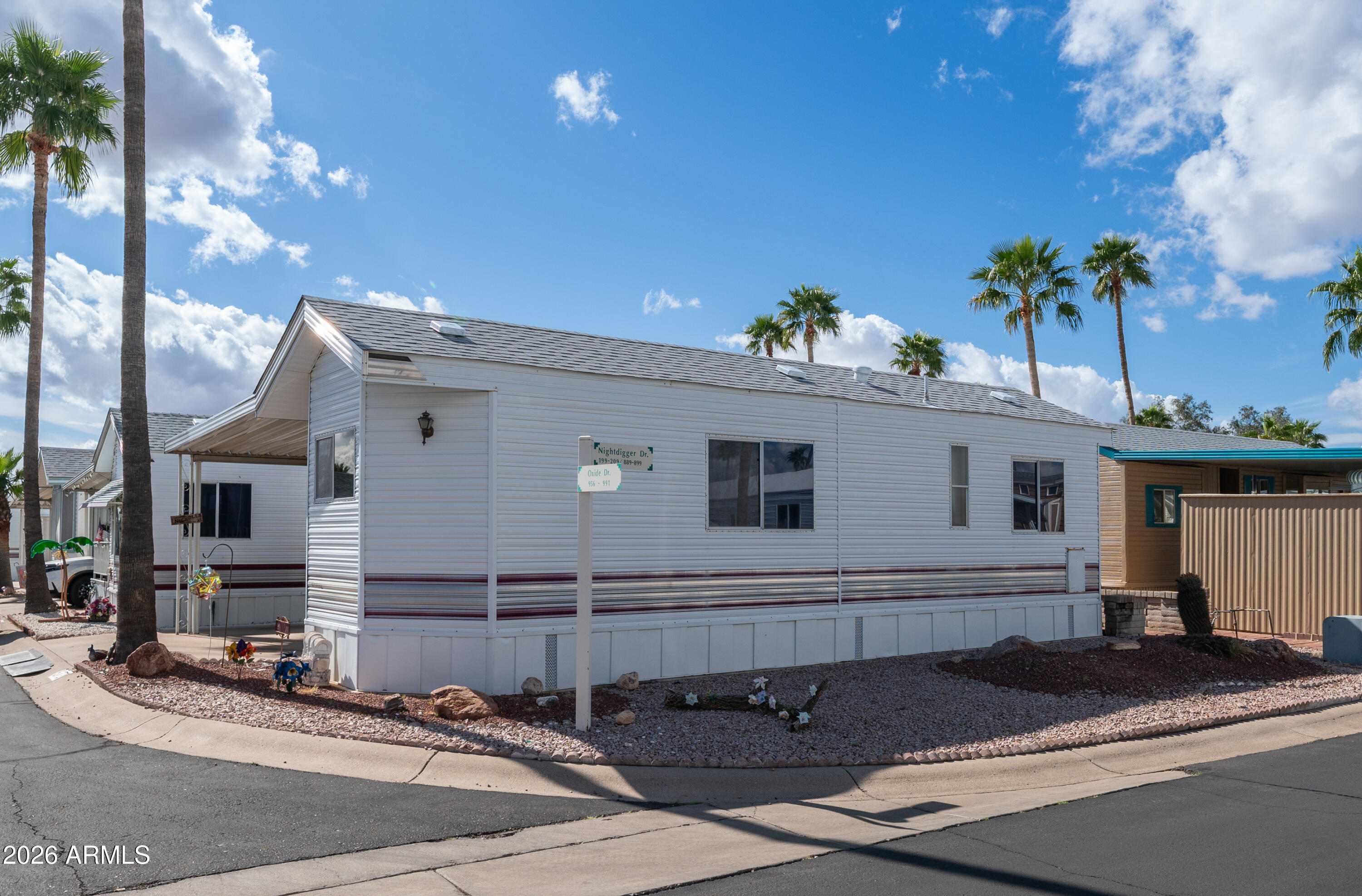 3710 South Goldfield Road, Unit 972 Apache Junction, AZ 85119 - Photo 5 of 60 a view of a house with a patio