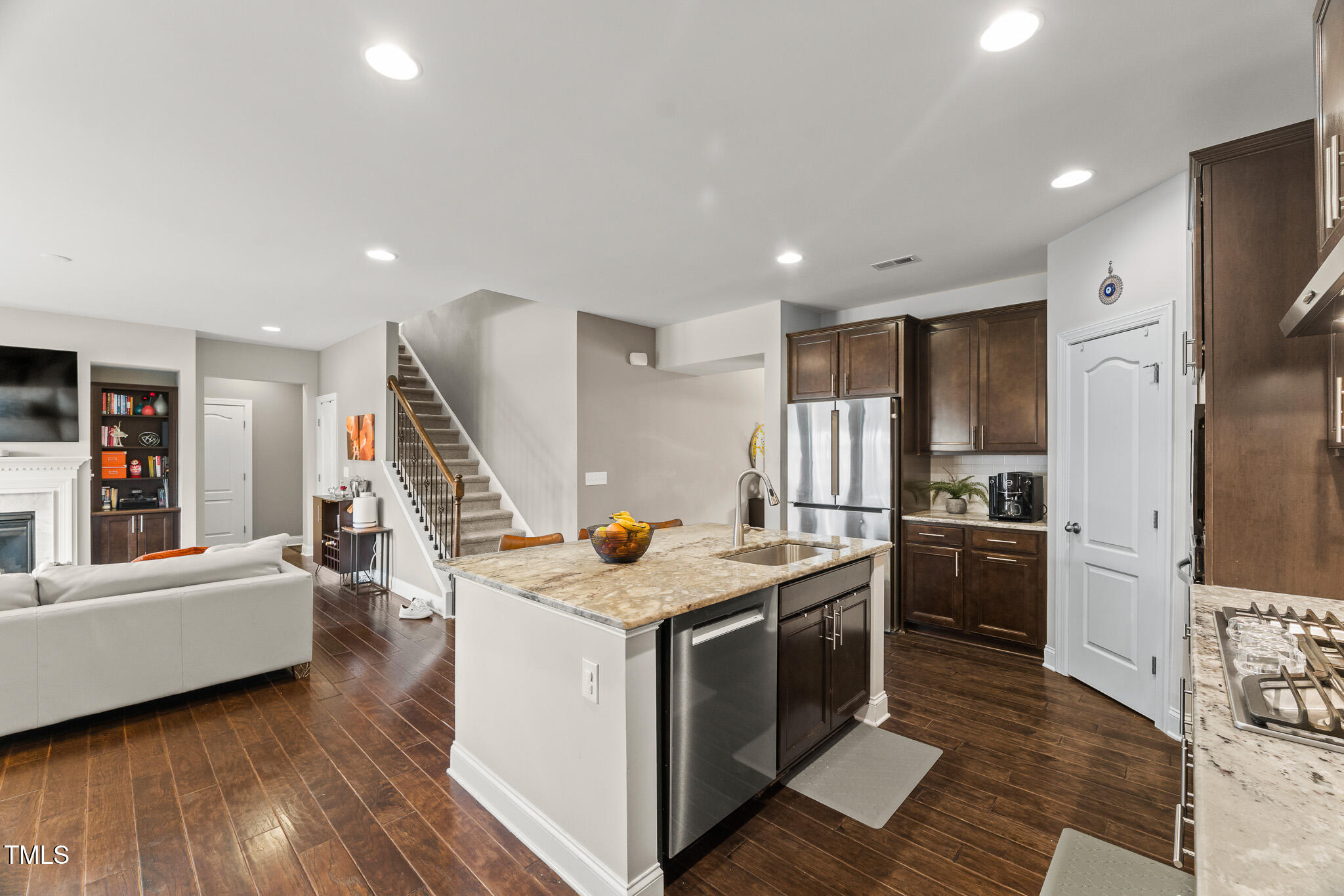 1715 Capstone Drive Durham, NC 27713 - Photo 11 of 53 a kitchen that has a lot of cabinets in it and wooden floors