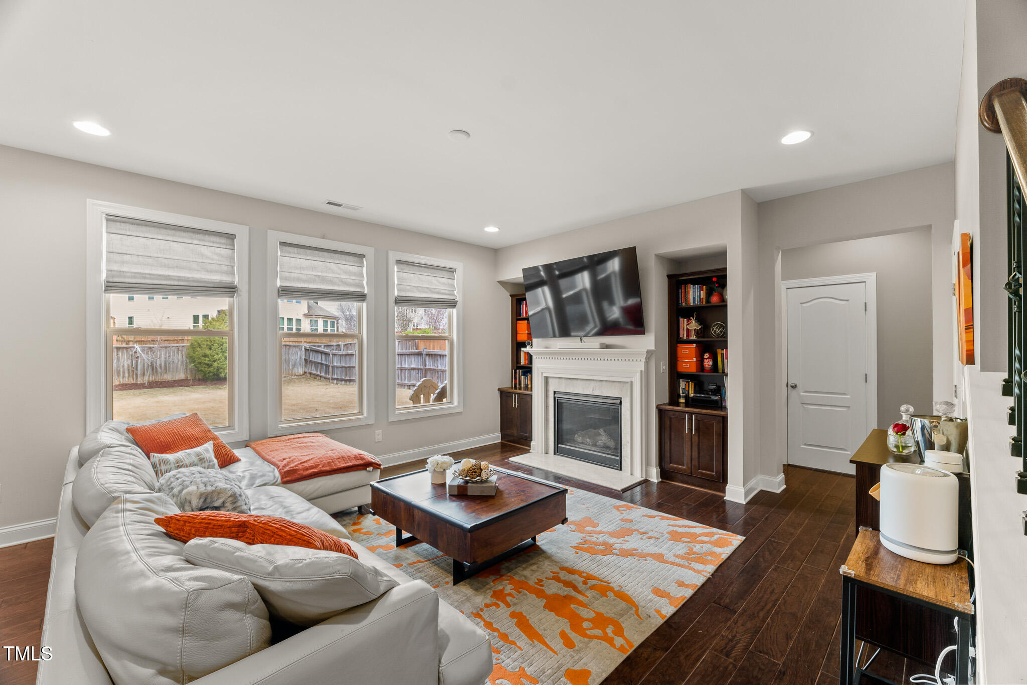 1715 Capstone Drive Durham, NC 27713 - Photo 12 of 53 a living room with furniture fireplace and flat screen tv