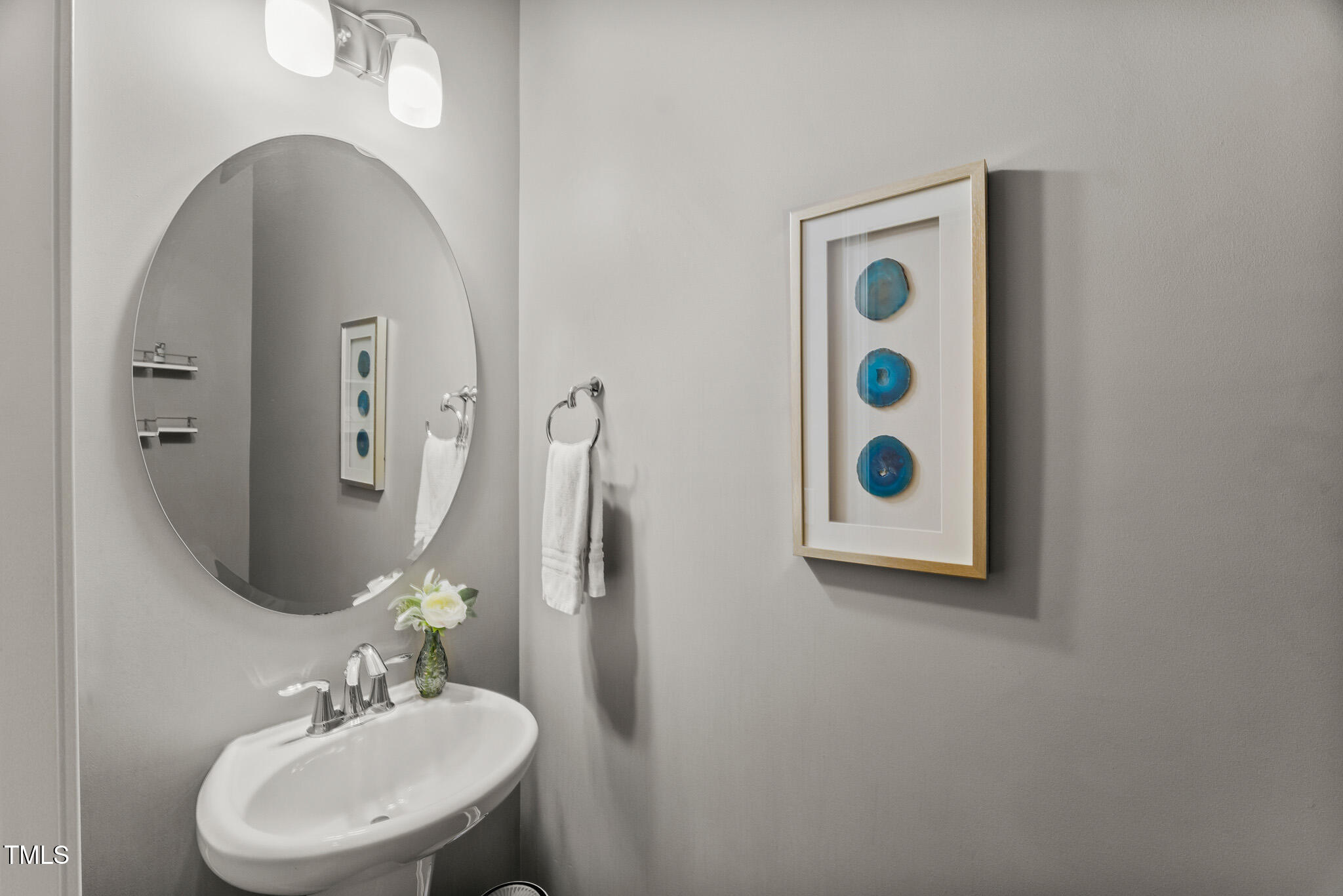 1715 Capstone Drive Durham, NC 27713 - Photo 14 of 53 a bathroom with a sink and a mirror