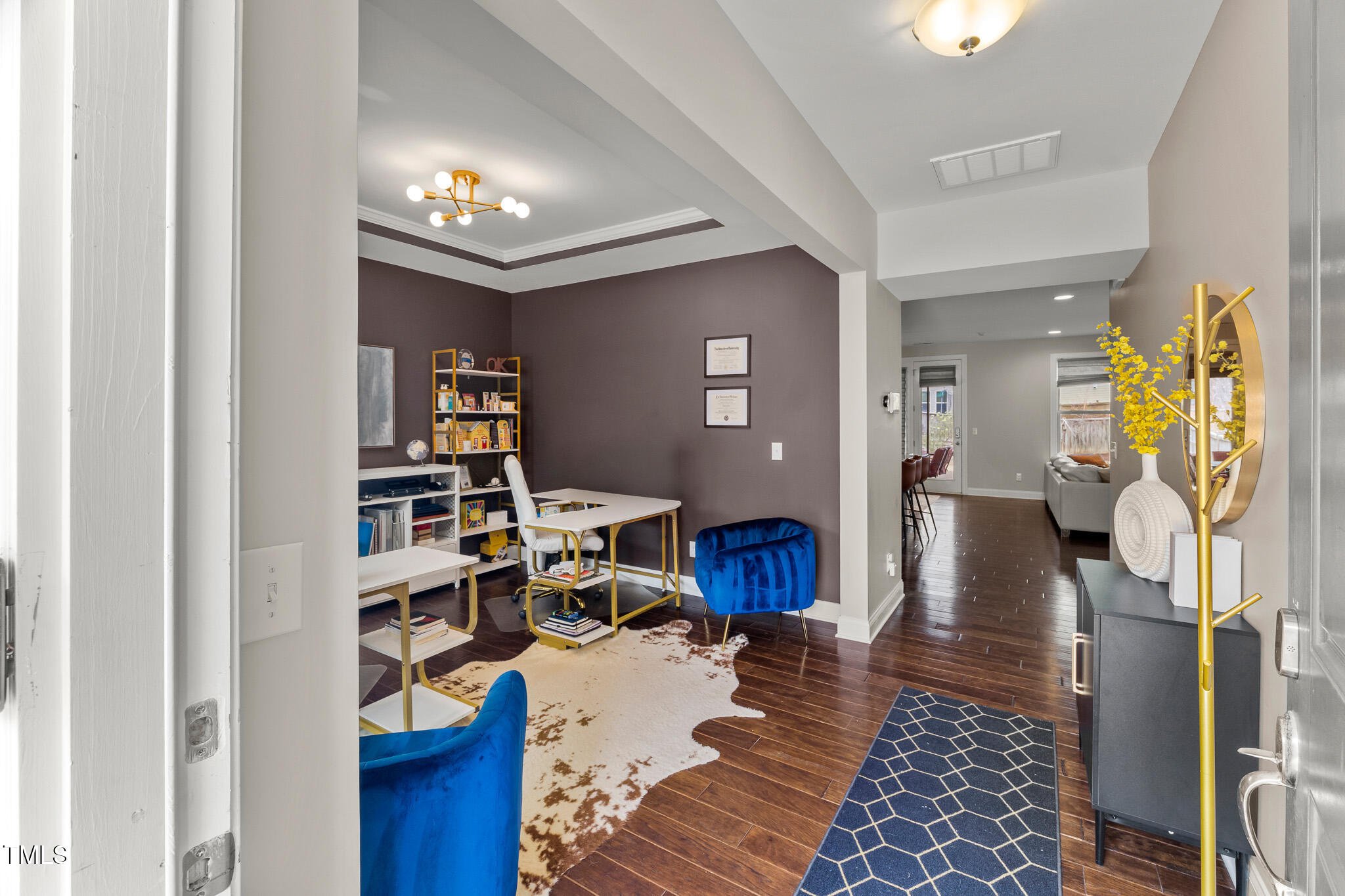 1715 Capstone Drive Durham, NC 27713 - Photo 15 of 53 a living room with furniture and a book shelf