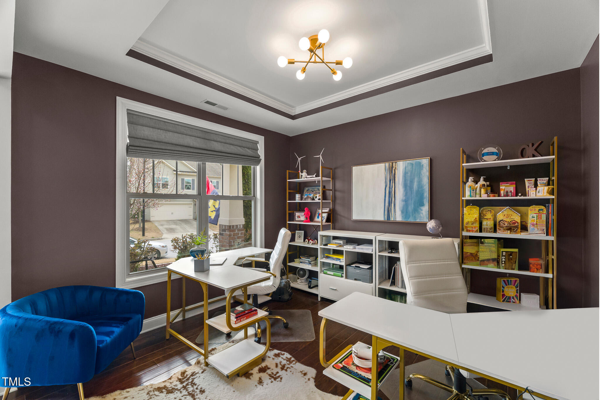 1715 Capstone Drive Durham, NC 27713 - Photo 18 of 53 a living room with furniture a bookshelf and a window