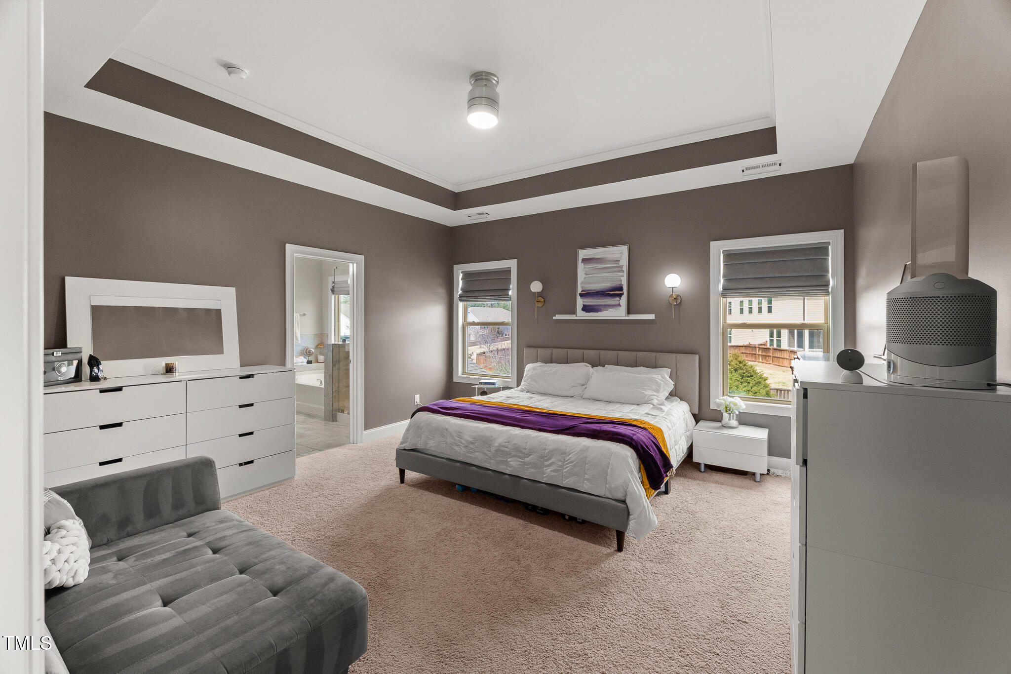 1715 Capstone Drive Durham, NC 27713 - Photo 22 of 53 a spacious bedroom with a bed and a couch