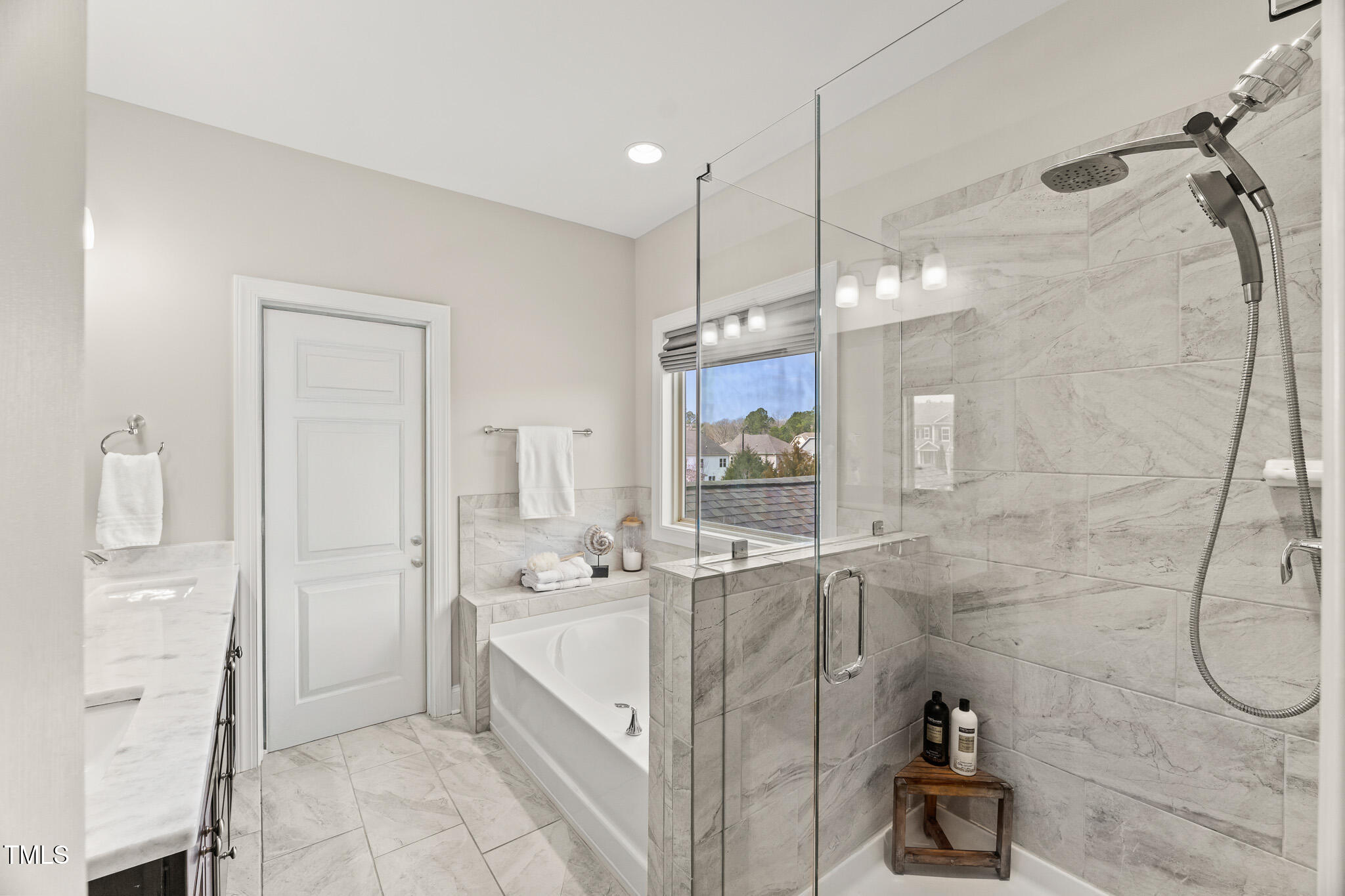 1715 Capstone Drive Durham, NC 27713 - Photo 26 of 53 a bathroom with a double vanity sink mirror and shower