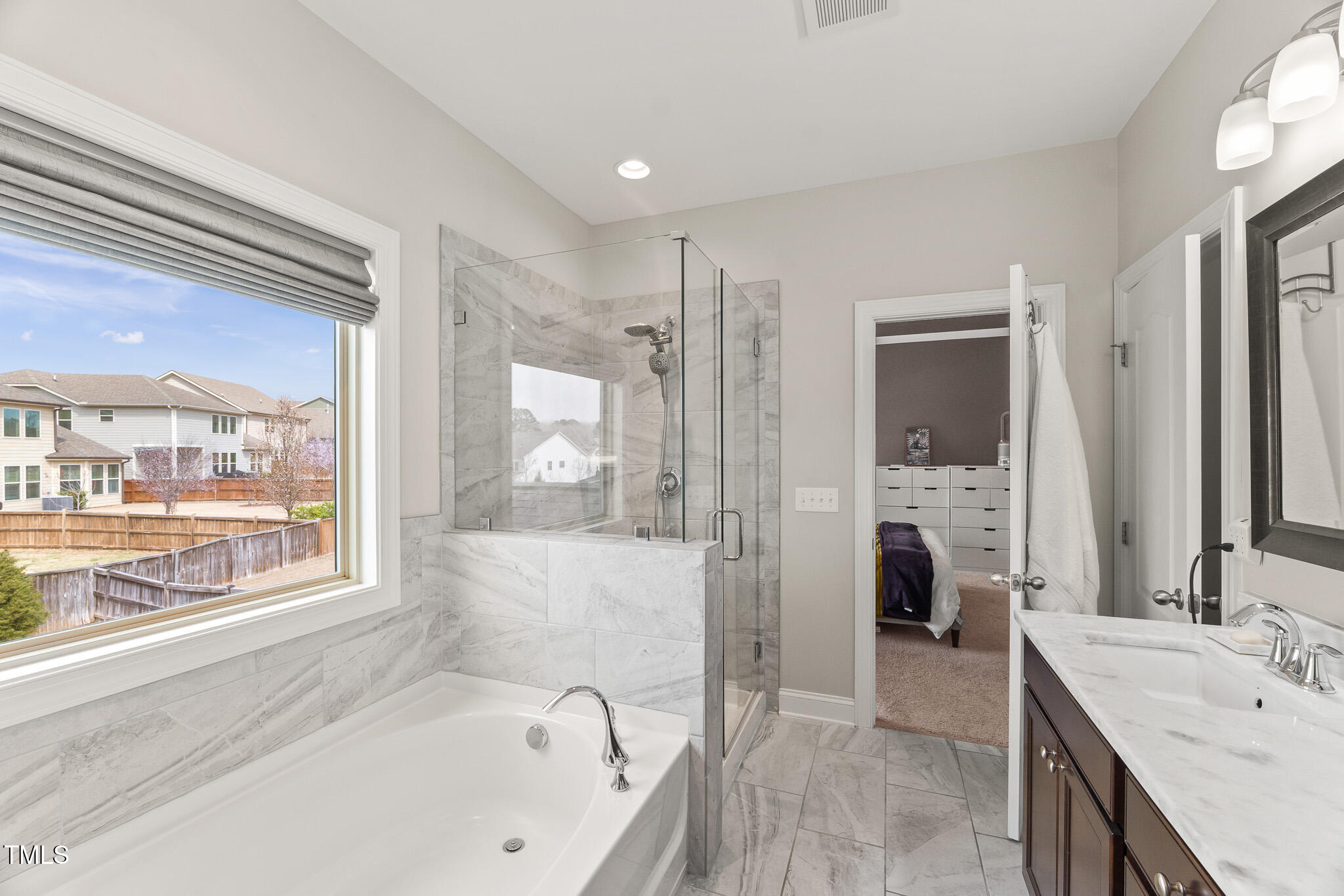 1715 Capstone Drive Durham, NC 27713 - Photo 27 of 53 a bathroom with a tub sink and mirror
