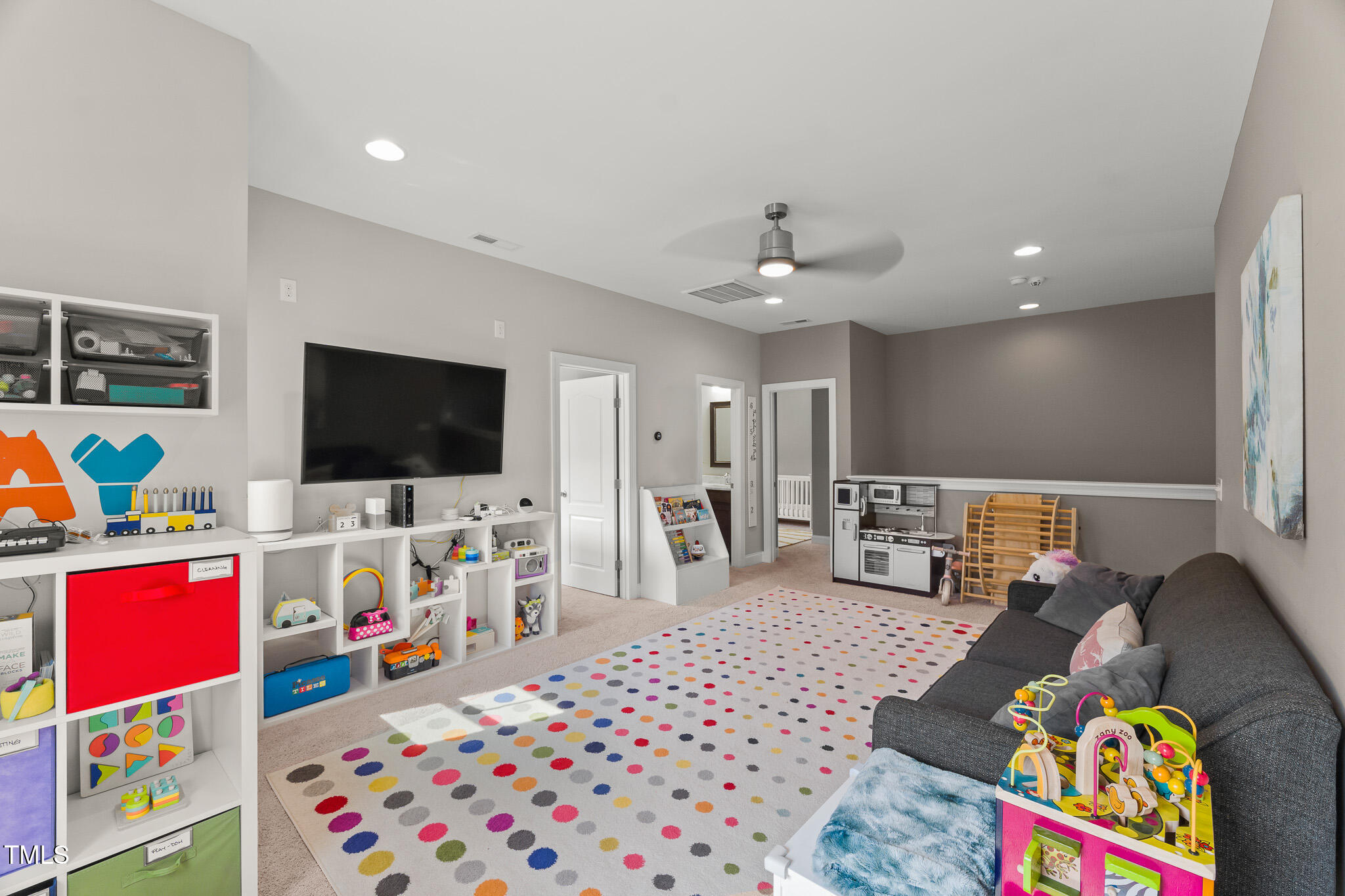 1715 Capstone Drive Durham, NC 27713 - Photo 32 of 53 a living room with furniture and a flat screen tv