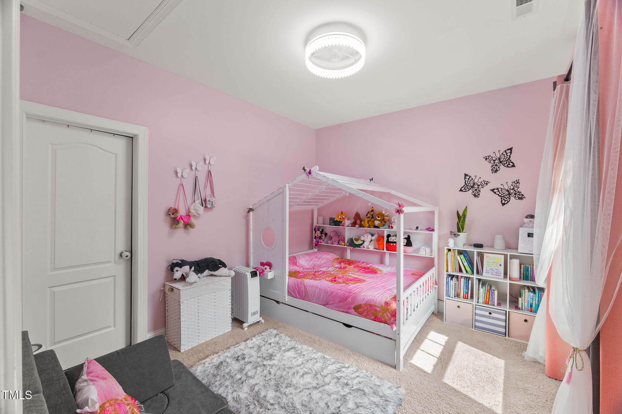 1715 Capstone Drive Durham, NC 27713 - Photo 33 of 53 a bedroom with a bed and a couch