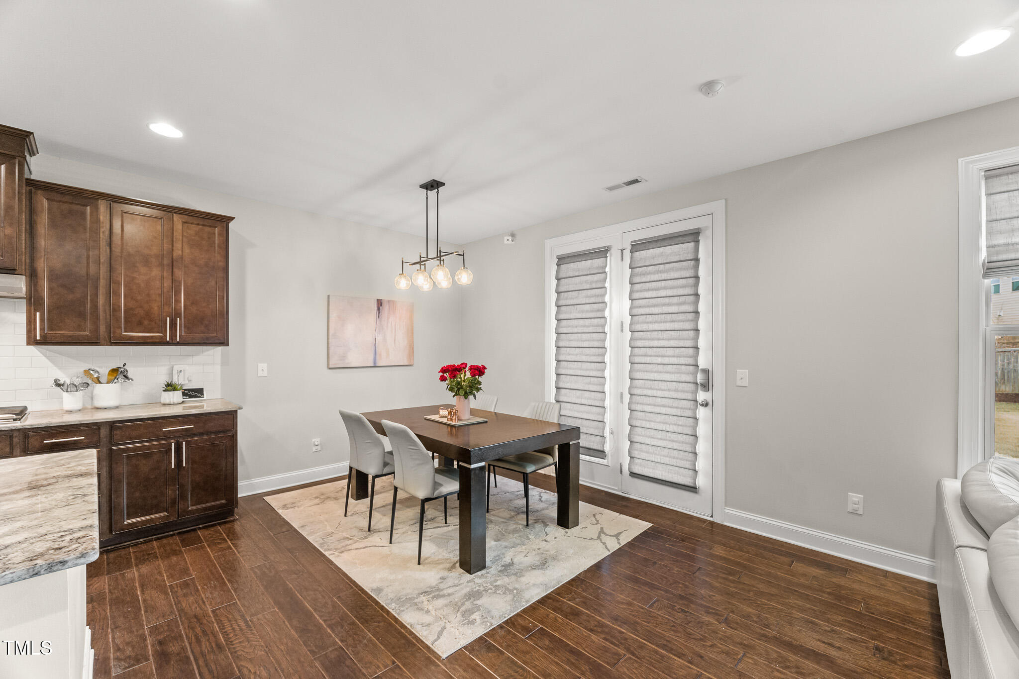 1715 Capstone Drive Durham, NC 27713 - Photo 6 of 53 a view of a dining room with furniture and wooden floor
