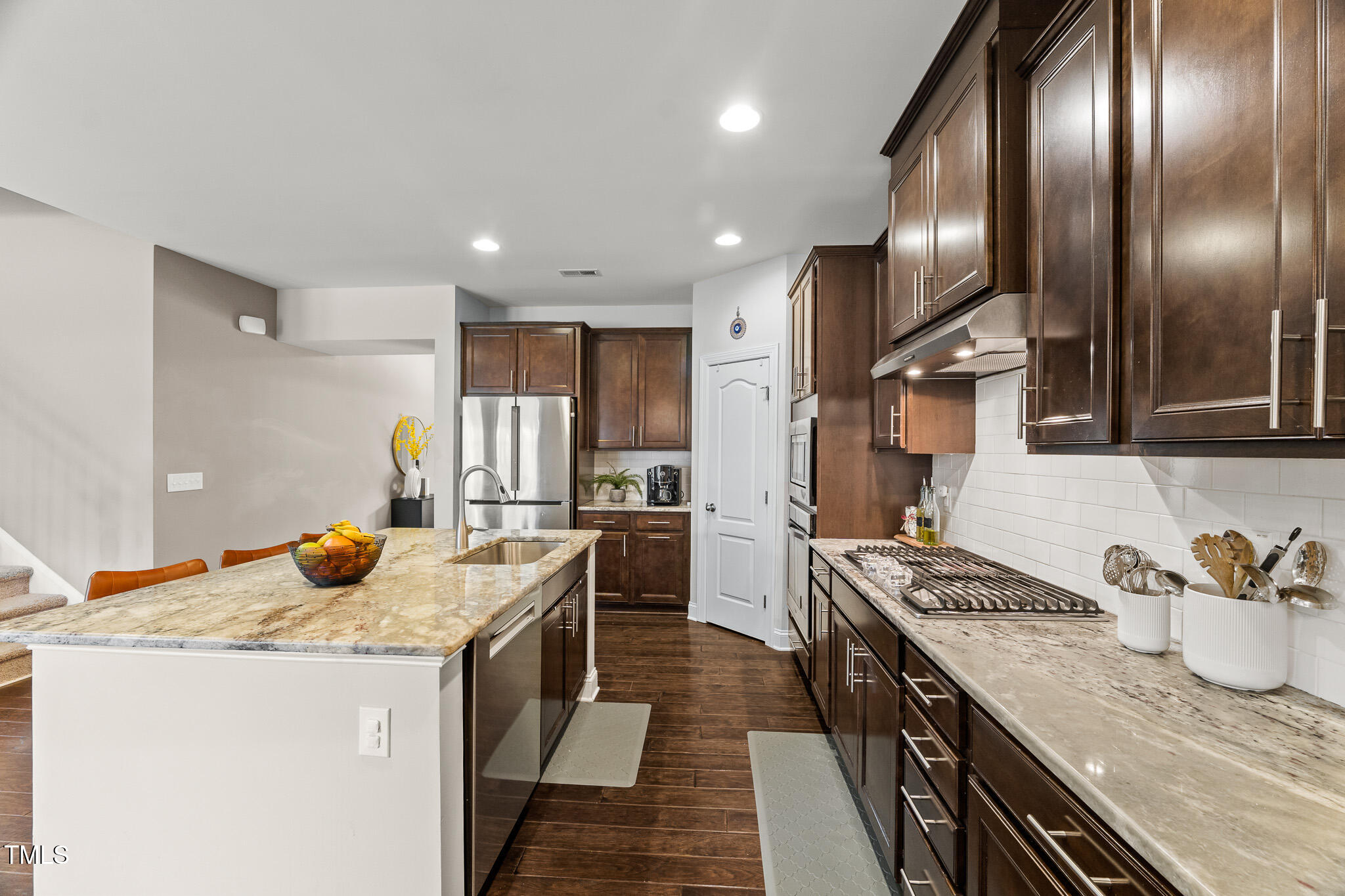 1715 Capstone Drive Durham, NC 27713 - Photo 10 of 53 a kitchen with granite countertop stainless steel appliances lots of counter top space