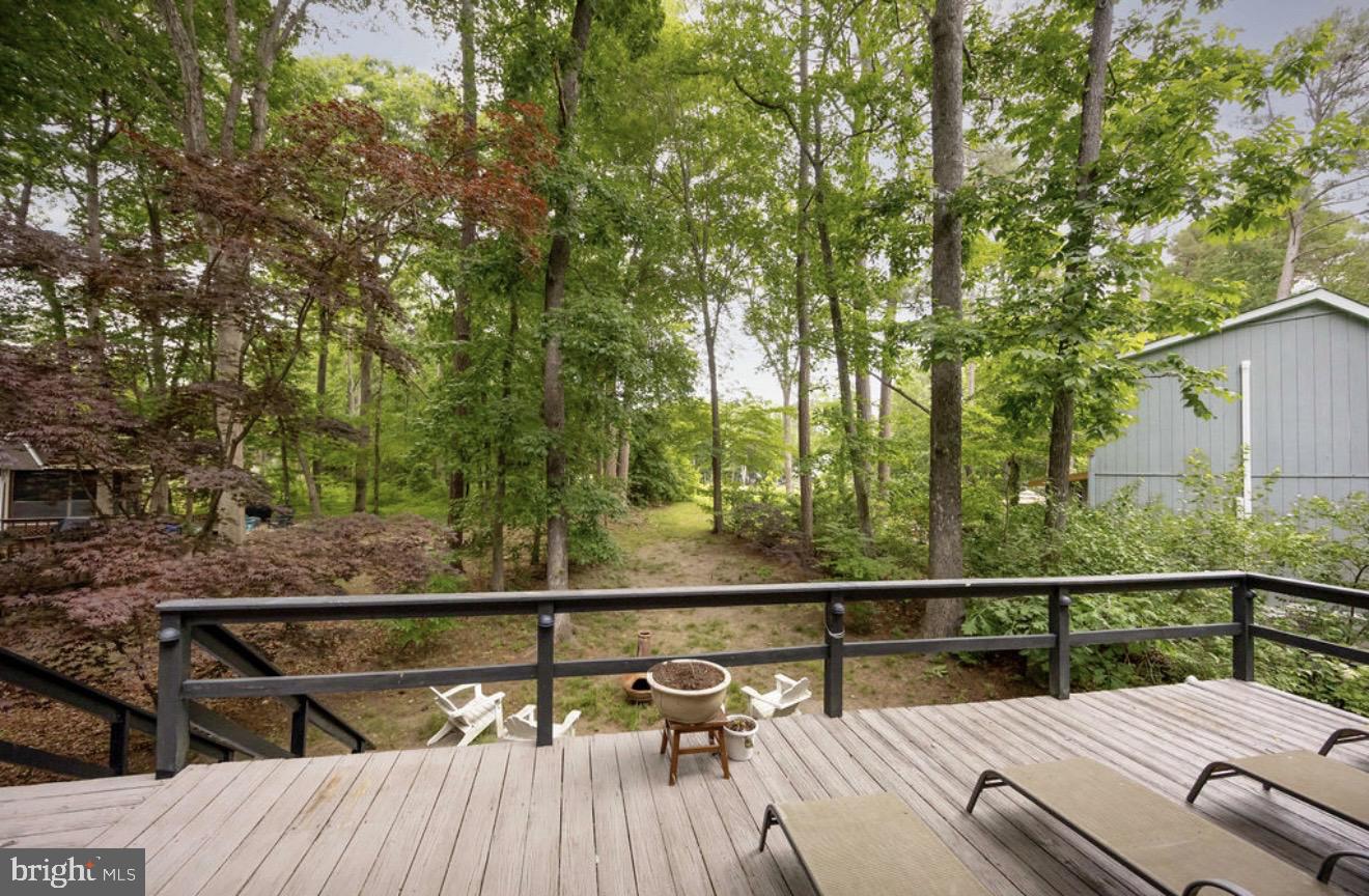 5 Falcon Bridge Road Ocean Pines, MD 21811 - Photo 48 of 59 a view of balcony with wooden floor and outdoor seating