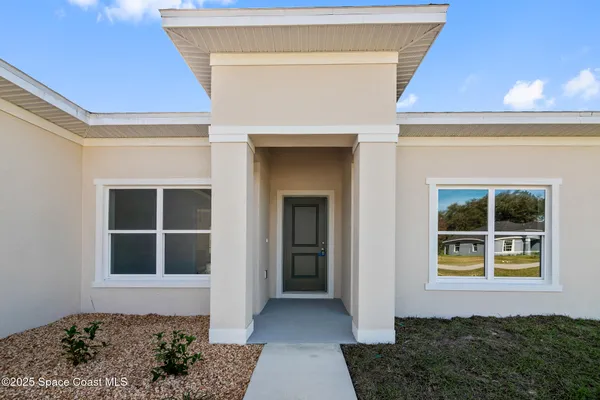 a front view of a house with window