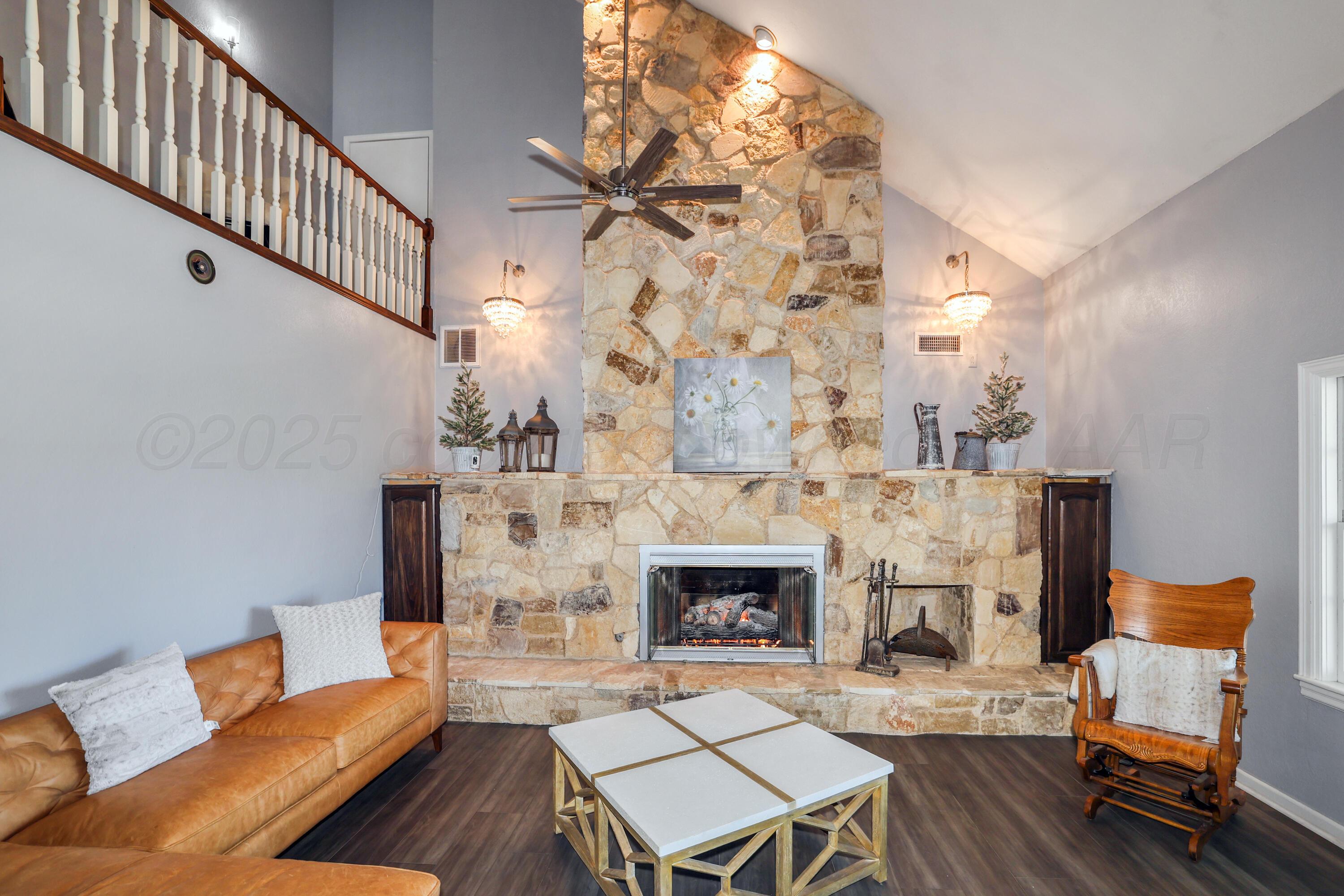 620 North Main Street Stratford, TX 79084 - Photo 9 of 51 a living room with furniture and a fireplace