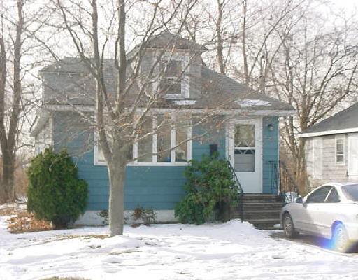 772 Rowland Road Fairfield, CT 06824 - Photo 1 of 1 a view of a white house next to a road and yard
