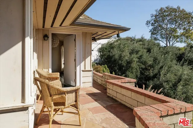 a view of balcony with furniture