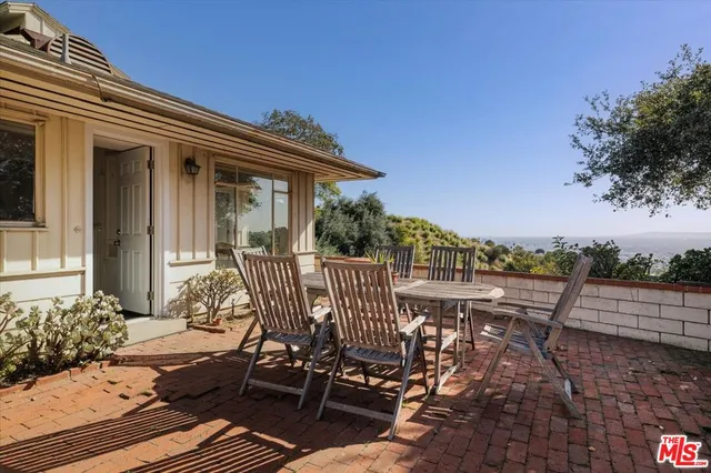 a view of a balcony with chairs