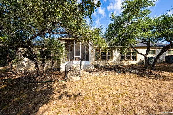 a view of a house with a yard covered in snow
