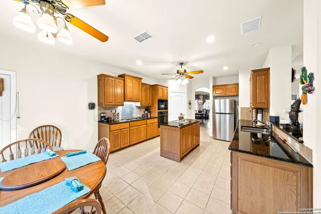 a living room with furniture fireplace and a large window