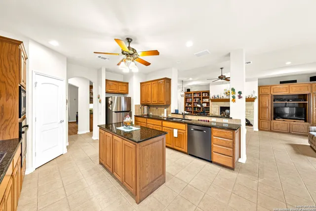 a spacious bedroom with a bed and a large window