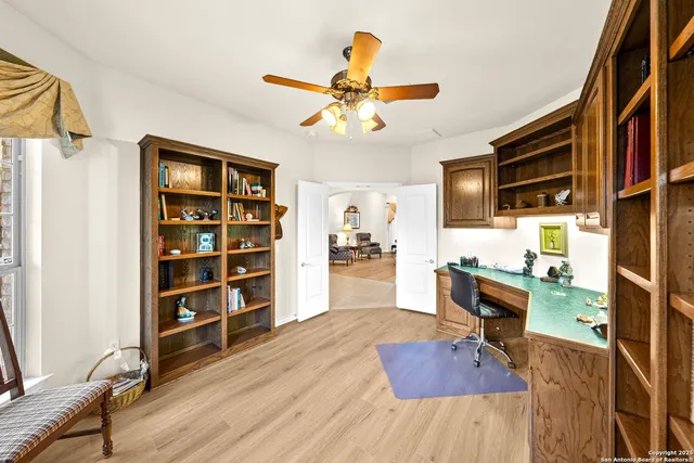 a bedroom with furniture a bed and a chandelier