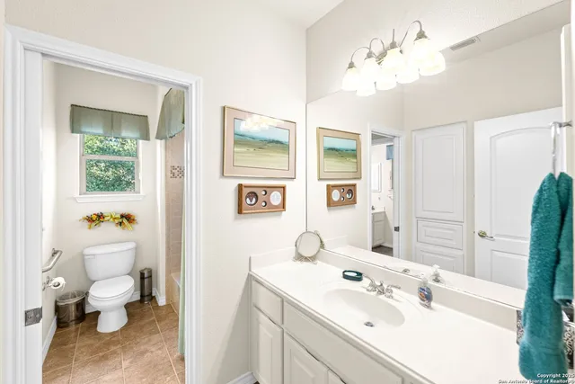 an aerial view of residential houses with city view