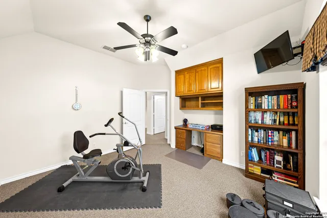 an aerial view of residential houses with city view