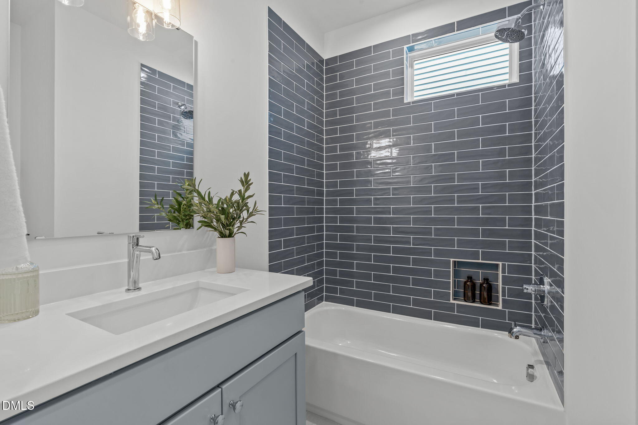 600 Rocky Knob Court Raleigh, NC 27601 - Photo 26 of 49 a bathroom with a sink a bathtub and a shower
