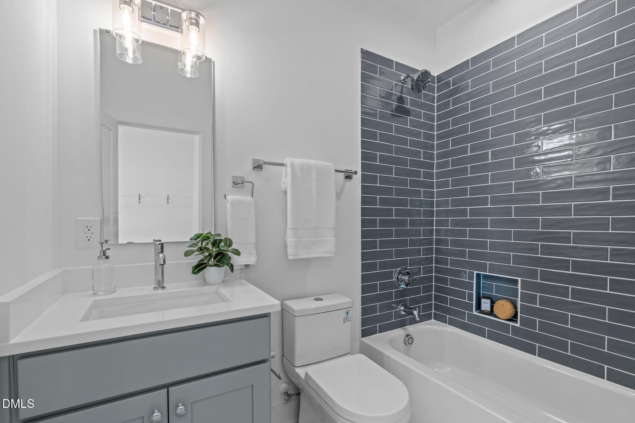 600 Rocky Knob Court Raleigh, NC 27601 - Photo 32 of 49 a bathroom with a sink a toilet and shower