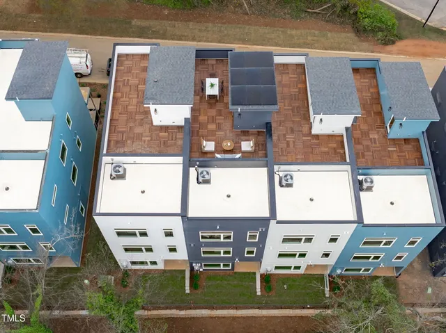 aerial view of a house with a yard