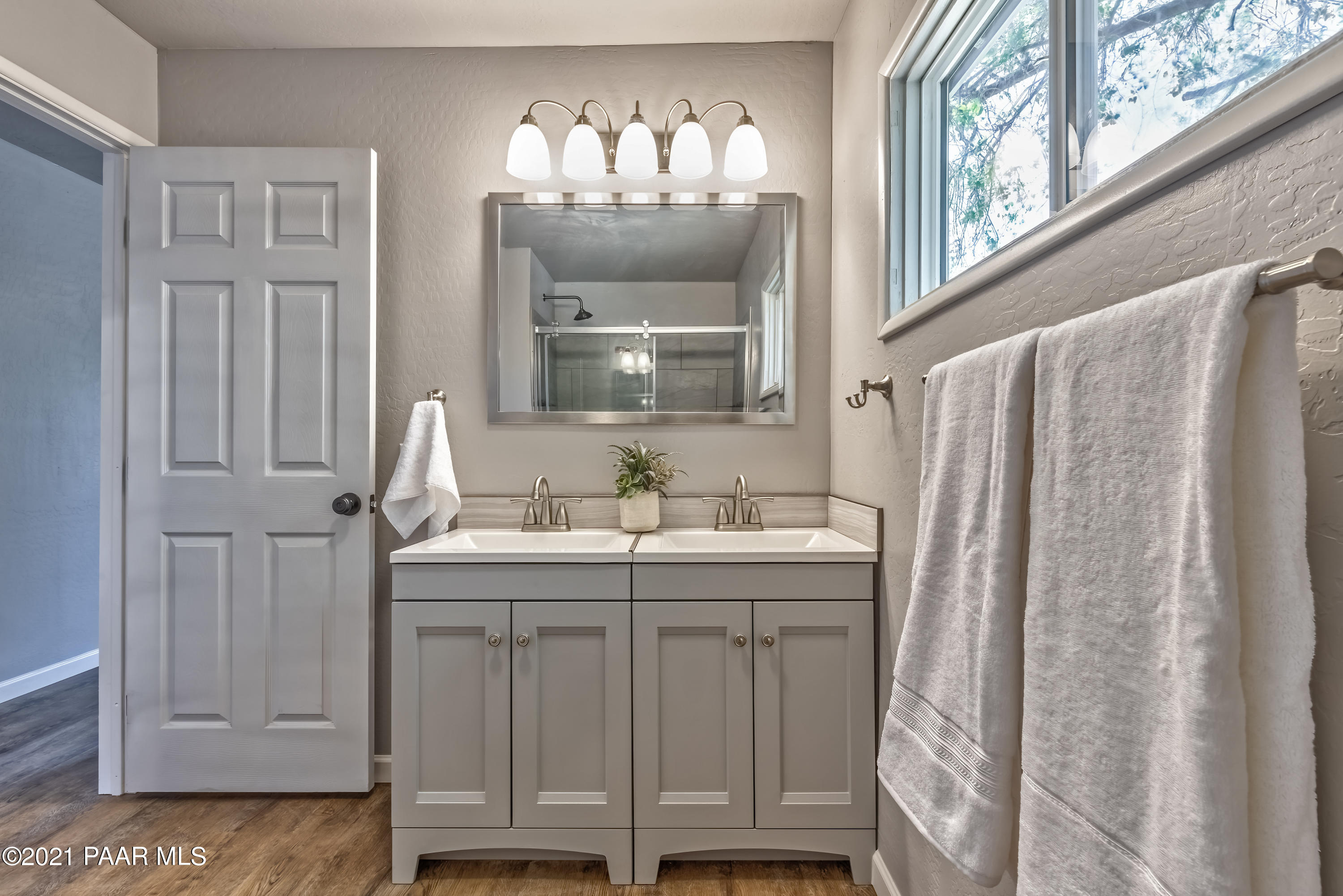 844 Flora Street Prescott, AZ 86301 - Photo 15 of 29 a bathroom with a granite countertop sink and a mirror