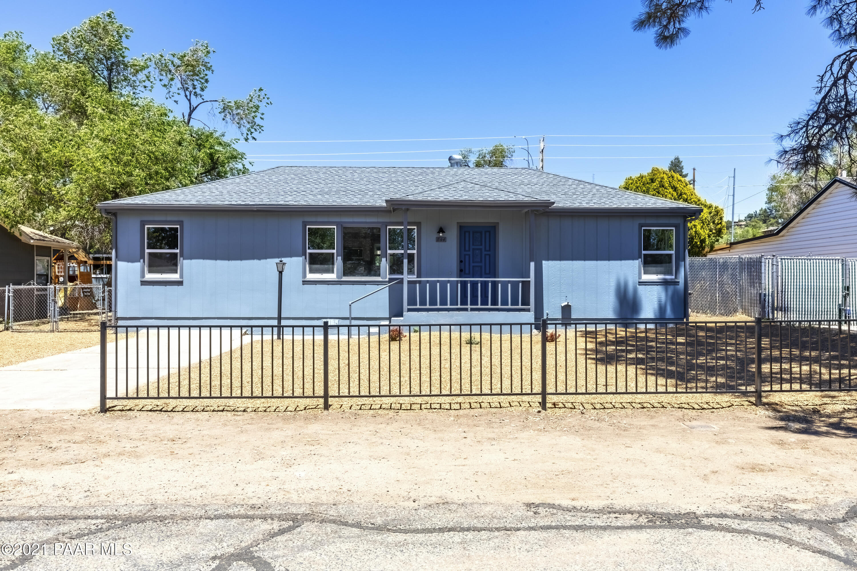 844 Flora Street Prescott, AZ 86301 - Photo 2 of 29 a front view of a house with a fence