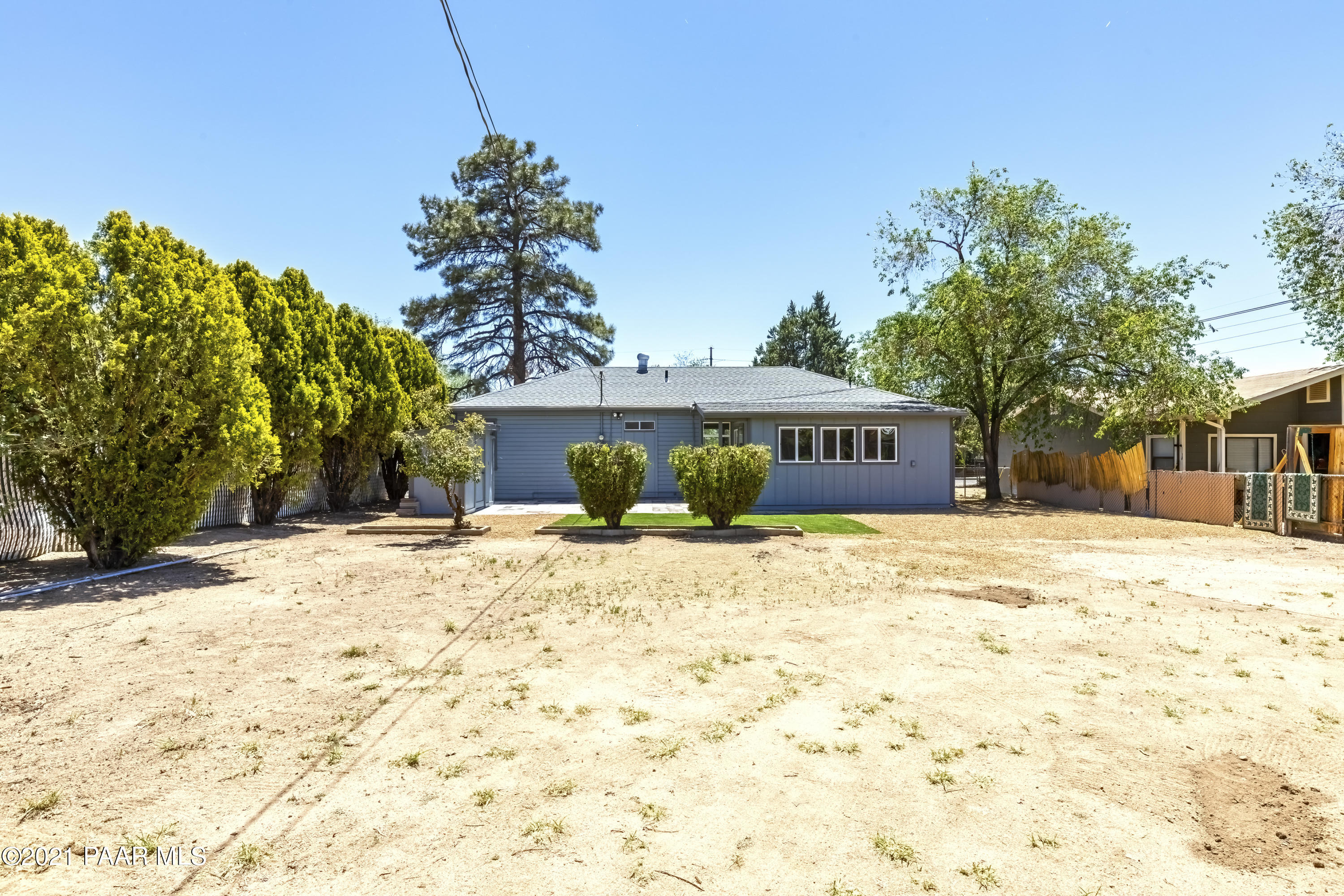 844 Flora Street Prescott, AZ 86301 - Photo 24 of 29 a front view of a house with a yard and trees