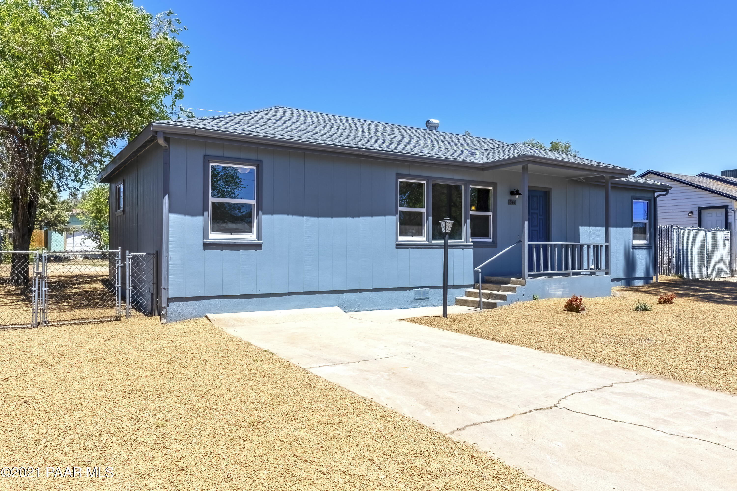844 Flora Street Prescott, AZ 86301 - Photo 25 of 29 a backyard of a house with table and chairs