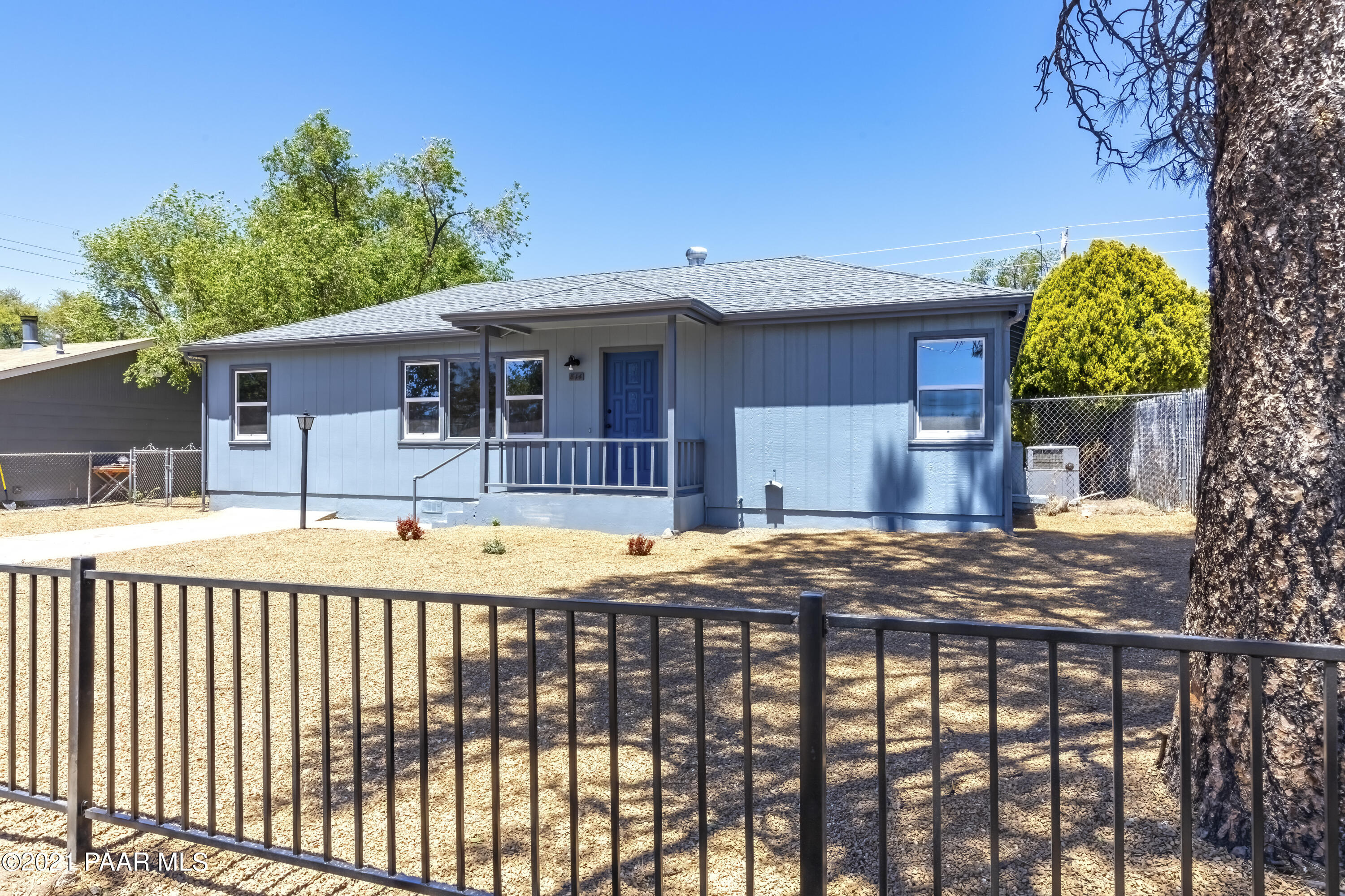 844 Flora Street Prescott, AZ 86301 - Photo 3 of 29 a view of a house with a swimming pool
