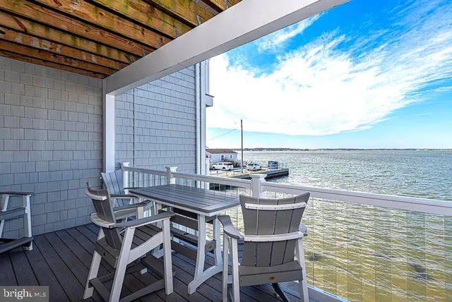 a kitchen with a refrigerator sink and cabinets