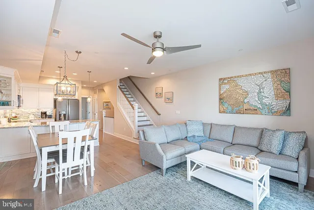 a kitchen with granite countertop a sink stove and refrigerator