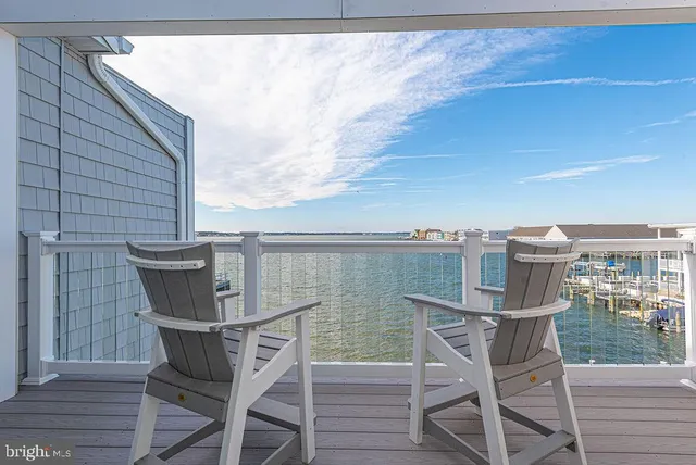 a bedroom with a bed next to a window and a walk in closet