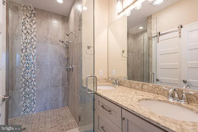 a view of a lake with couches chairs and potted plants