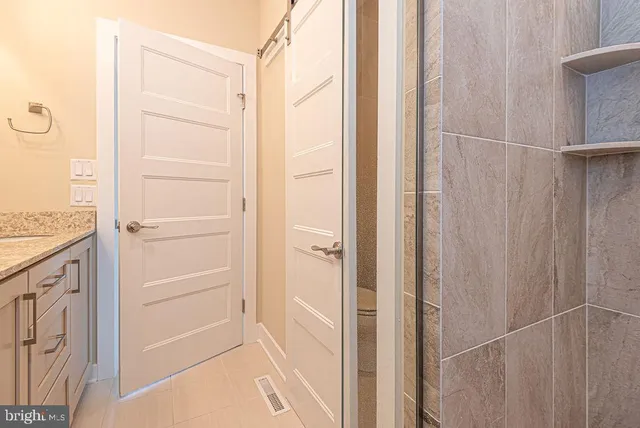 an aerial view of a house with ocean view
