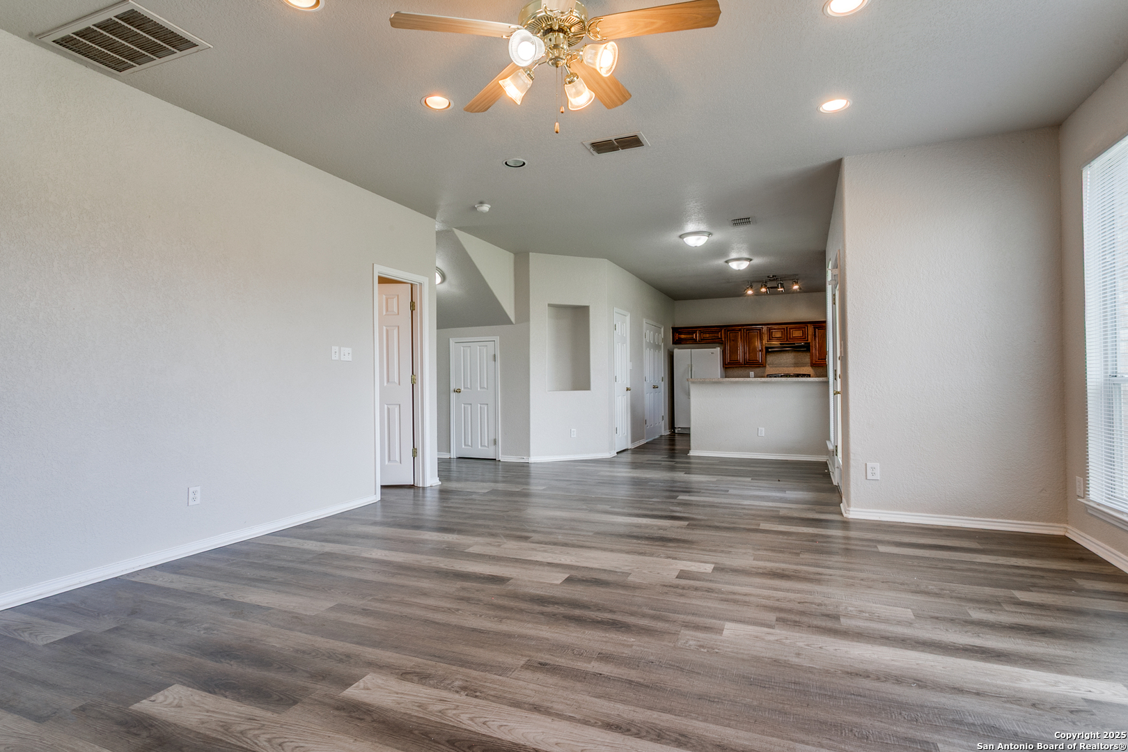 21715 Hanover Crest San Antonio, TX 78259 - Photo 11 of 25 a view of empty room with wooden floor