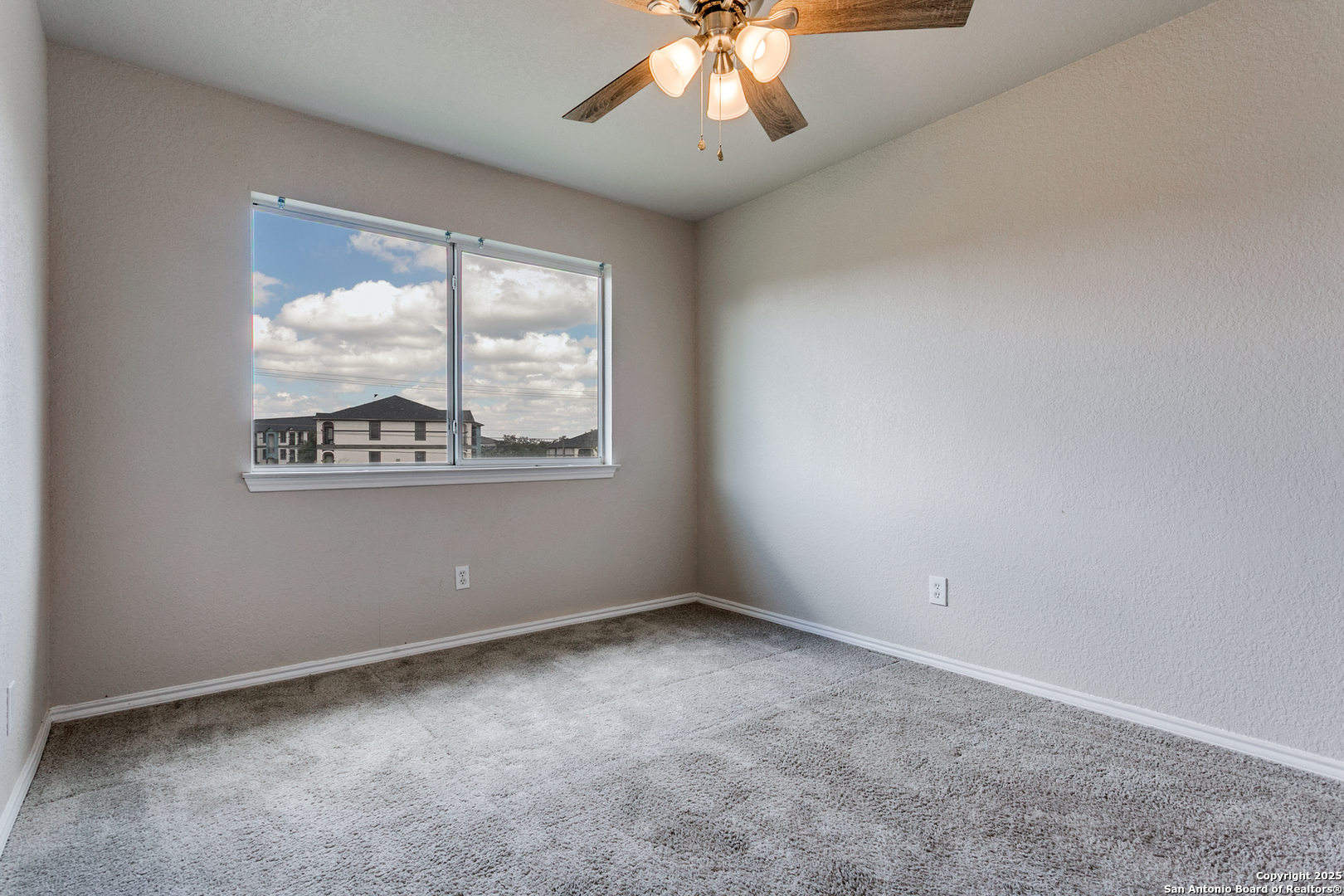 21715 Hanover Crest San Antonio, TX 78259 - Photo 18 of 25 an empty room with a window