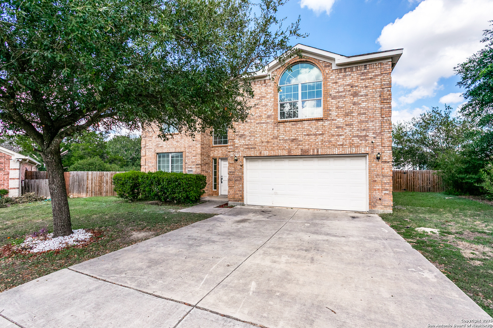 21715 Hanover Crest San Antonio, TX 78259 - Photo 2 of 25 a front view of a house with a yard and garage