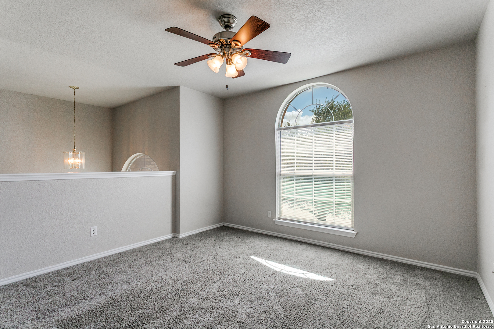21715 Hanover Crest San Antonio, TX 78259 - Photo 22 of 25 an empty room with windows and fan