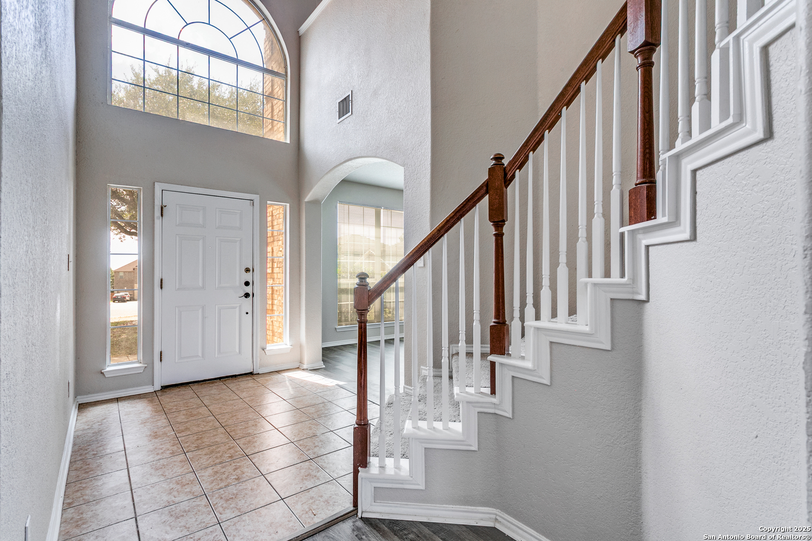 21715 Hanover Crest San Antonio, TX 78259 - Photo 3 of 25 a view of staircase with lots of frames on wall and wooden floor