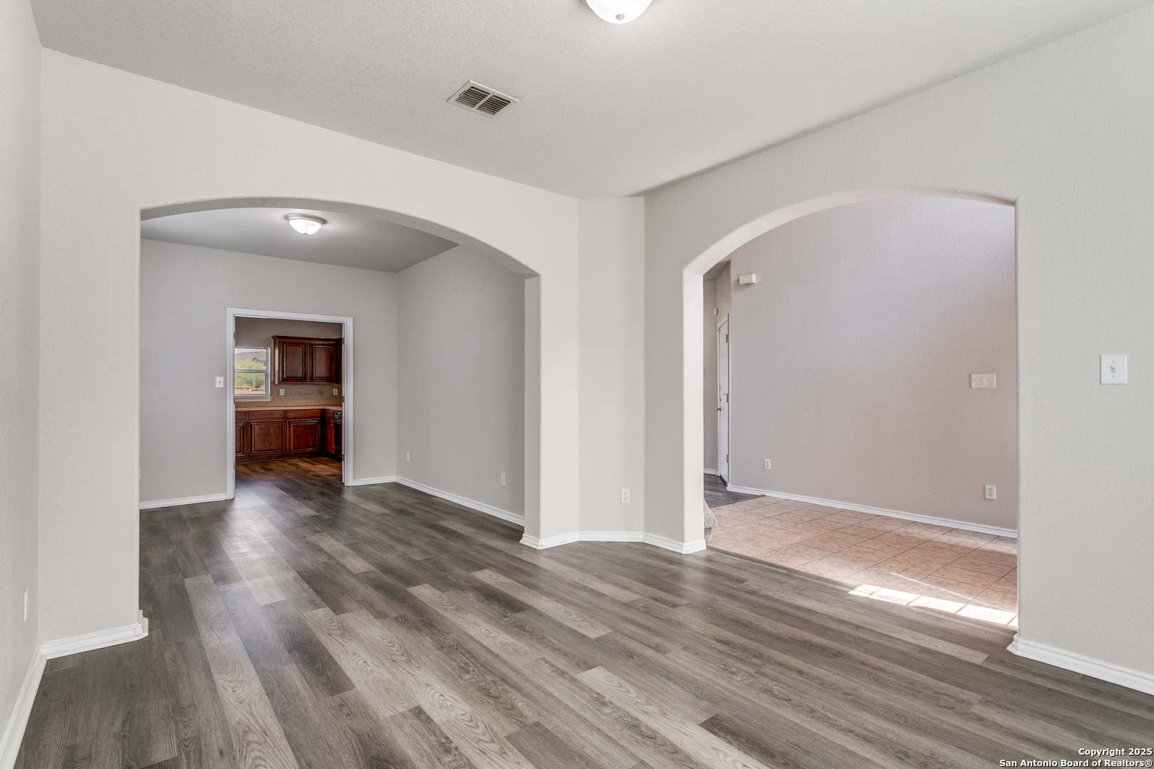21715 Hanover Crest San Antonio, TX 78259 - Photo 6 of 25 wooden floor in an empty room with a window