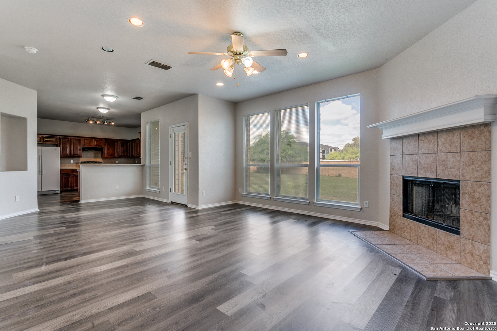 21715 Hanover Crest San Antonio, TX 78259 - Photo 9 of 25 a view of a room with a fireplace cabinet and windows