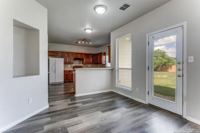 a view of kitchen with wooden floor