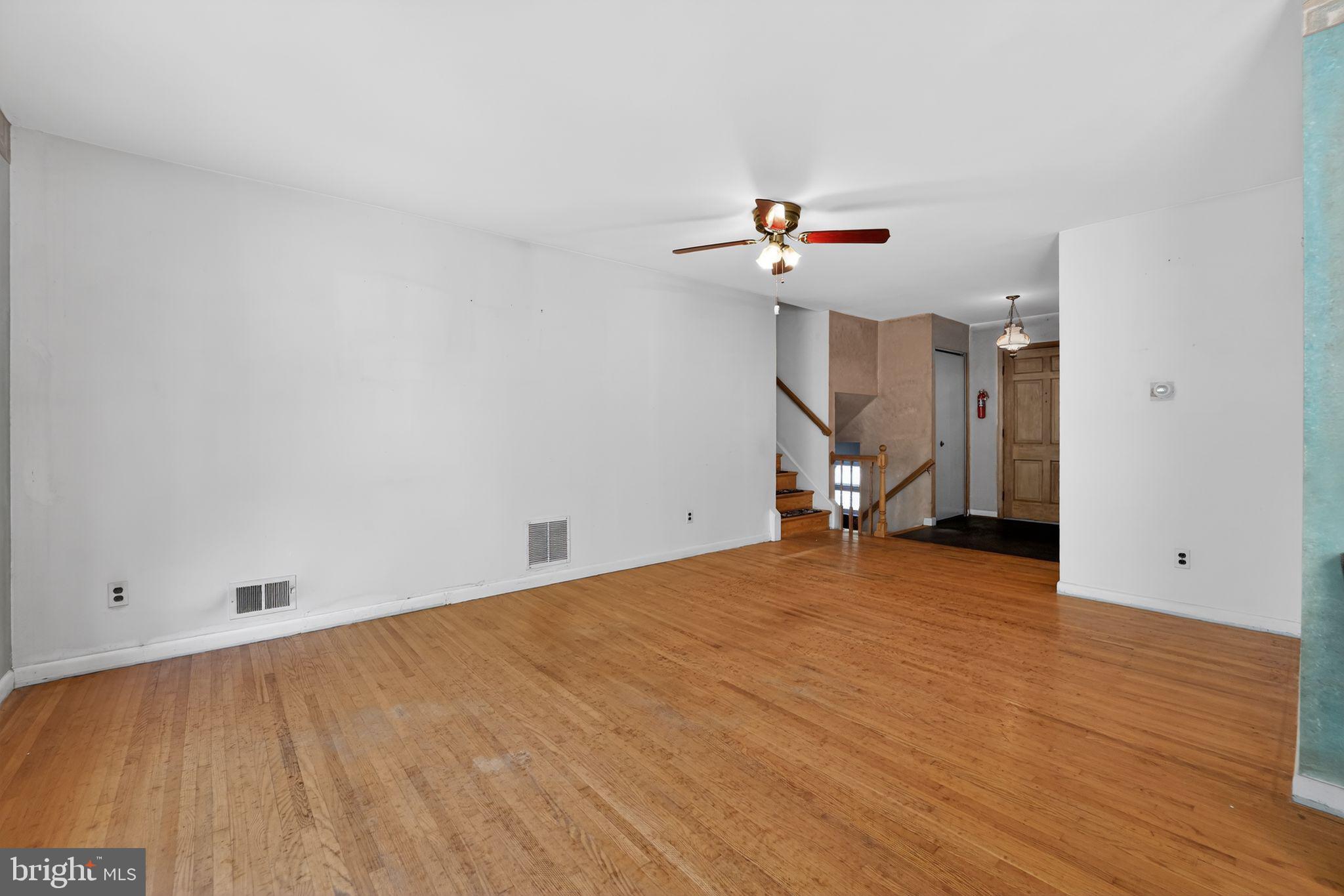 7012 Redmiles Road Laurel, MD 20707 - Photo 15 of 31 a view of empty room with wooden floor
