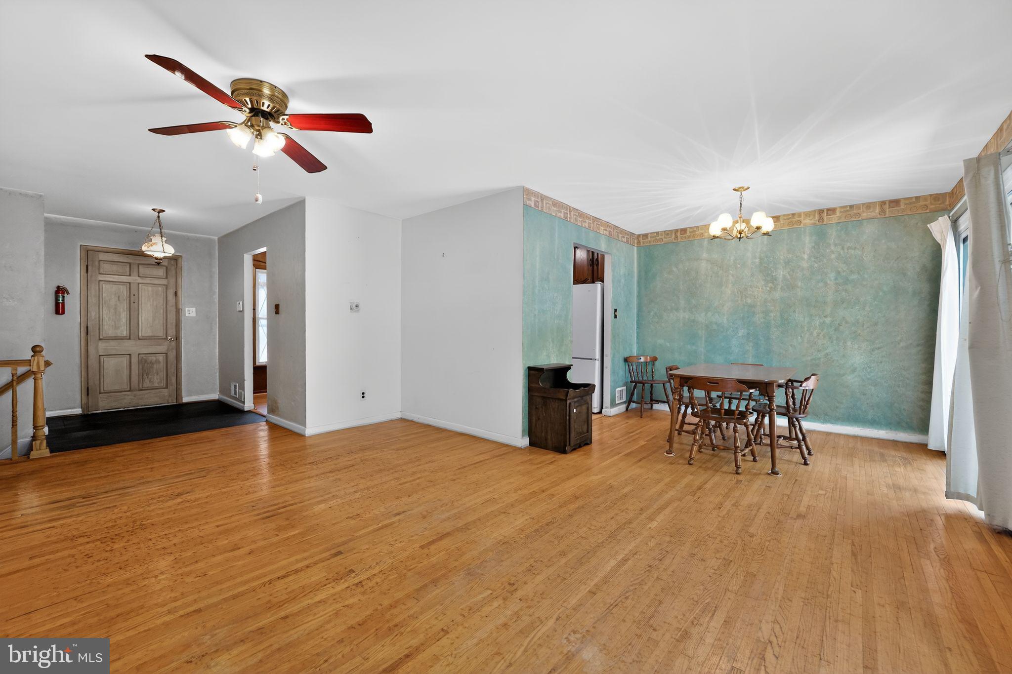 7012 Redmiles Road Laurel, MD 20707 - Photo 20 of 31 a view of a livingroom with furniture and a ceiling fan